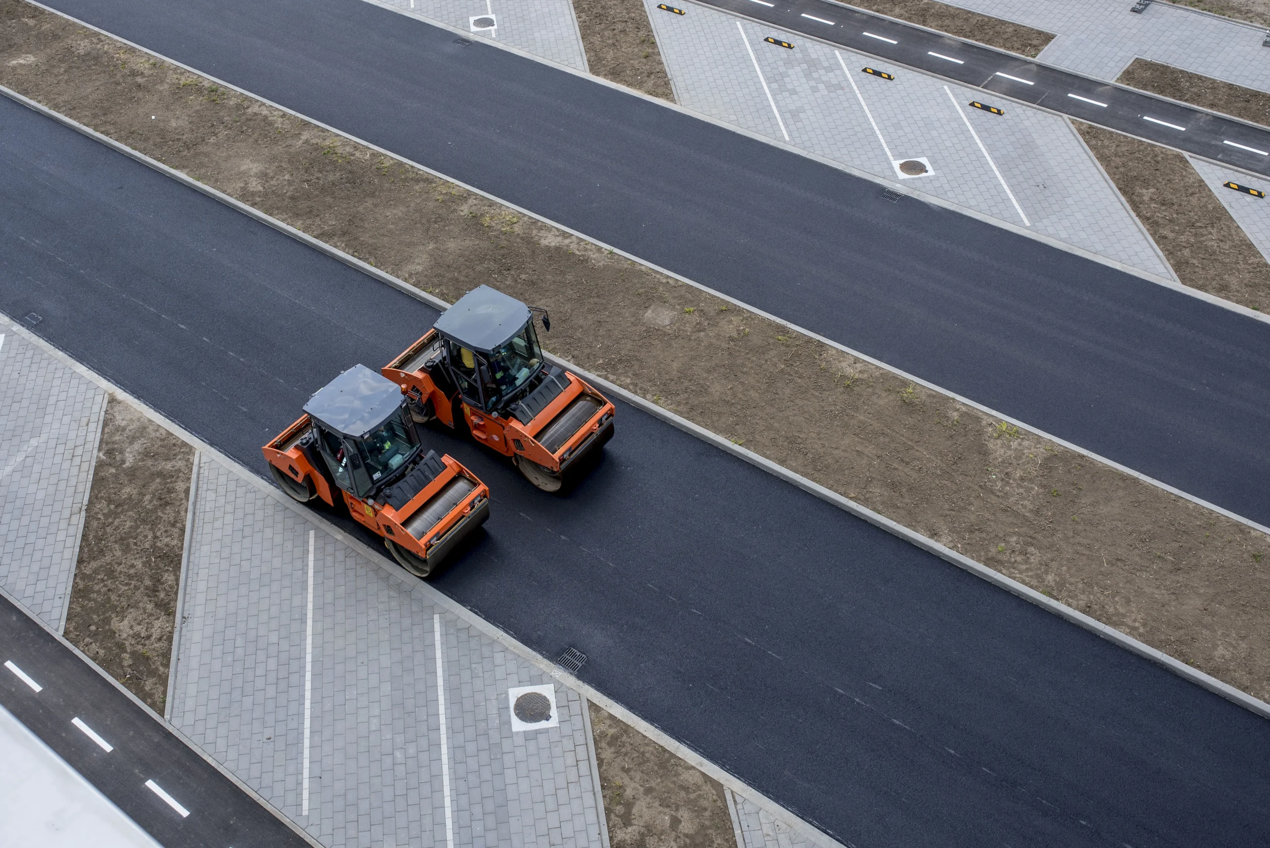 aerial-view-orange-vibratory-asphalt-roller-compactor-new-pavement