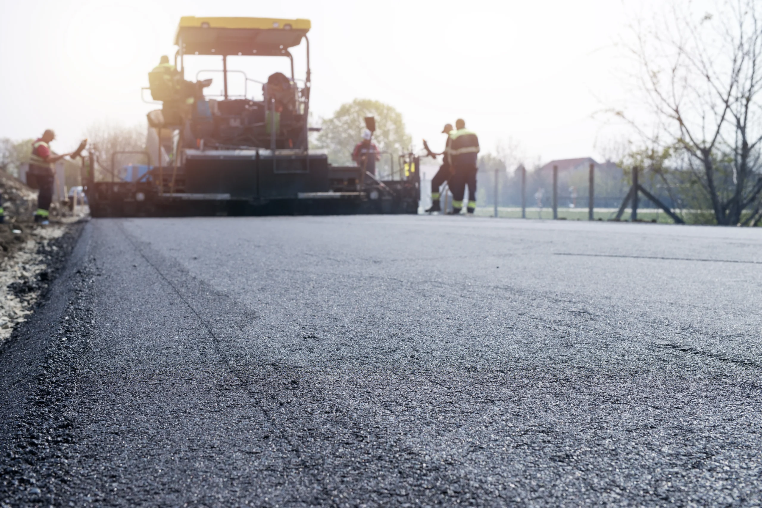 workers-placing-new-coating-asphalt-road (1)